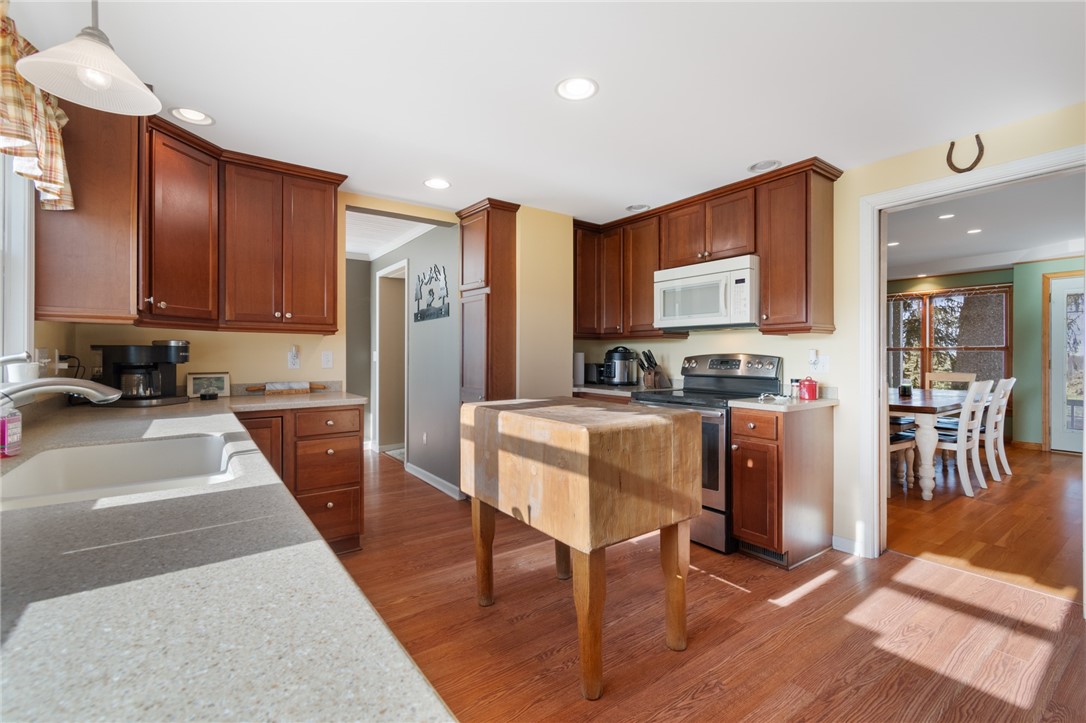 4244 Pearsall Road Williamson, NY 14589 - Photo 27 of 45 The kitchen to the dining room view