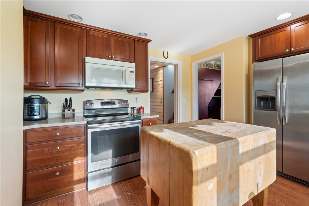 4244 Pearsall Road Williamson, NY 14589 - Photo 28 of 45 This updated kitchen has CORIAN countertops and st