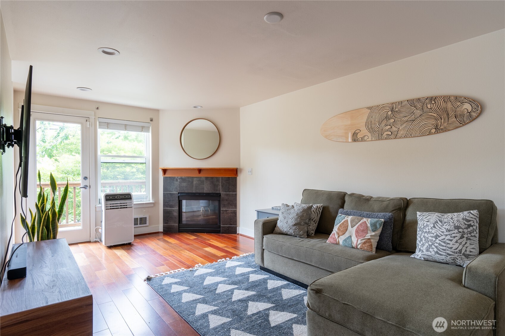 1419 Northwest 65th Street, Unit B Seattle, WA 98117 - Photo 15 of 26 a living room with furniture and a fireplace