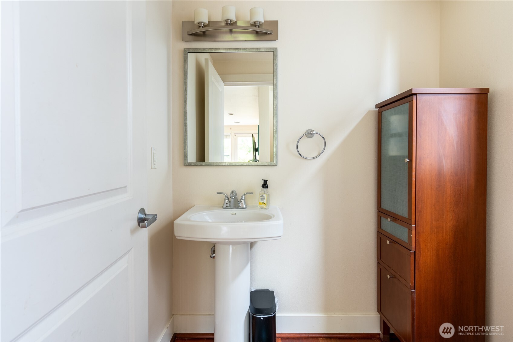 1419 Northwest 65th Street, Unit B Seattle, WA 98117 - Photo 20 of 26 a bathroom with a sink and a mirror