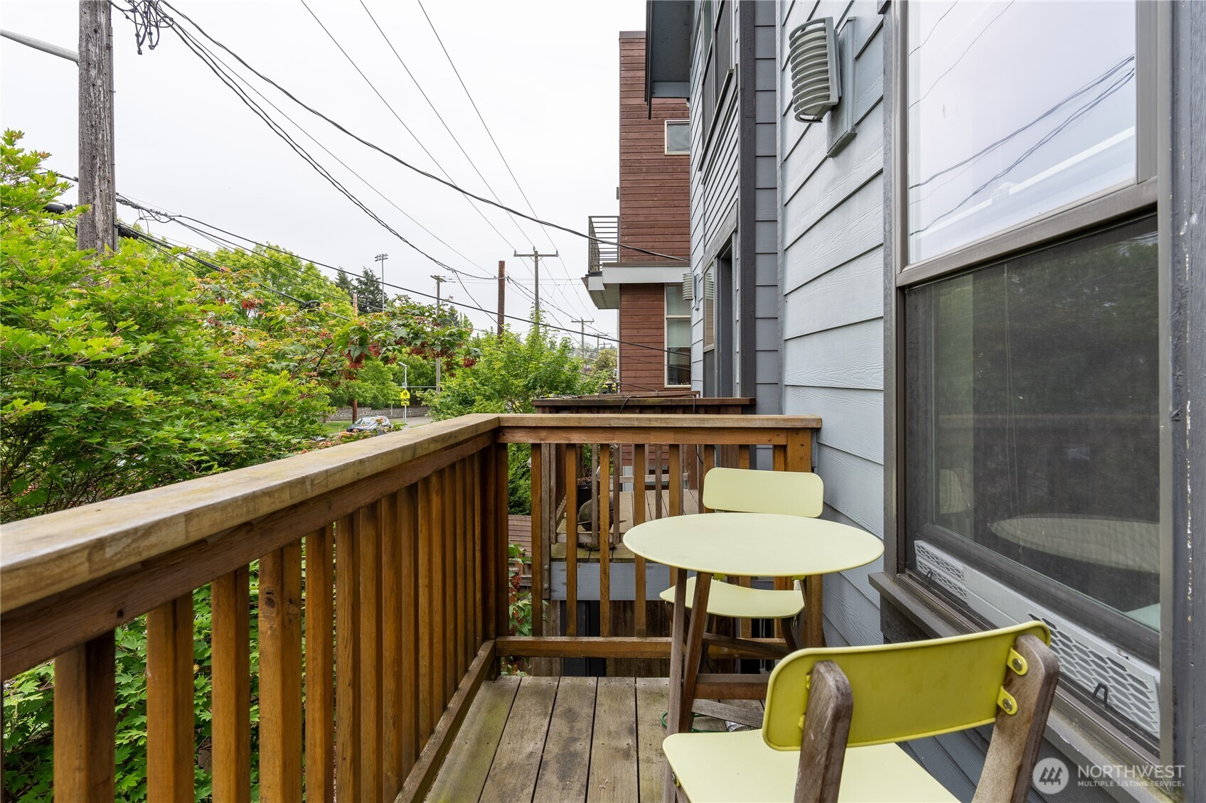 1419 Northwest 65th Street, Unit B Seattle, WA 98117 - Photo 23 of 26 a view of a chair and table in the balcony