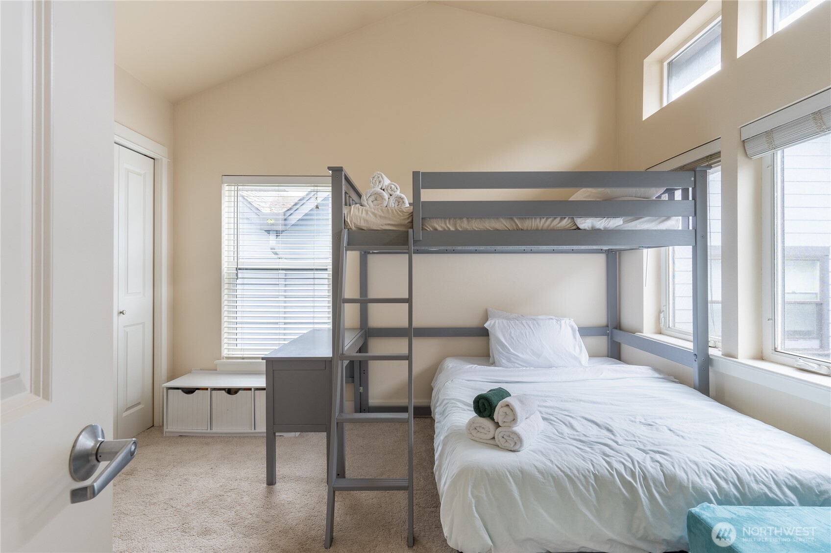 1419 Northwest 65th Street, Unit B Seattle, WA 98117 - Photo 7 of 26 a bedroom with a bed and a window
