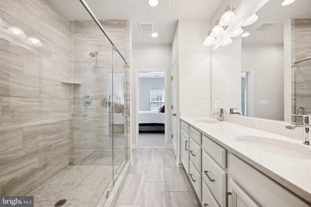 a spacious bedroom with a bed and a window