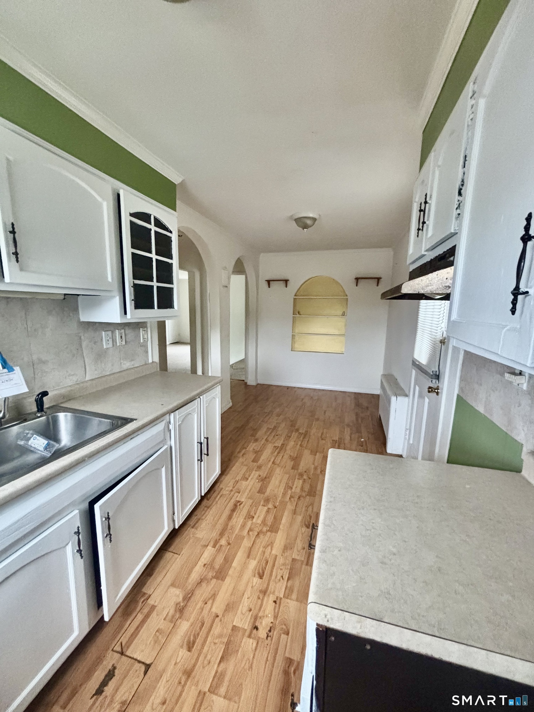 74 Standish Road, Unit 3 Stamford, CT 06902 - Photo 17 of 22 a kitchen with stainless steel appliances granite countertop a sink dishwasher stove and wooden cabinets