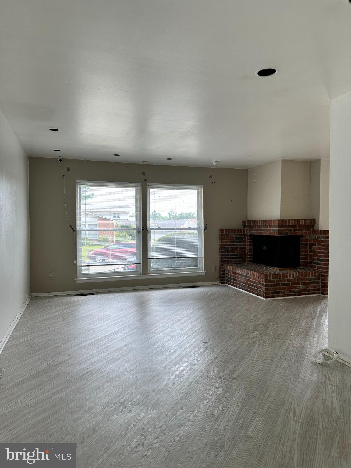 8336 Scotts Level Road Baltimore, MD 21208 - Photo 8 of 55 Bright, open space with cozy fireplace.