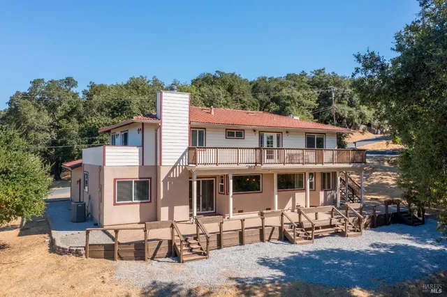 an aerial view of residential houses with outdoor space