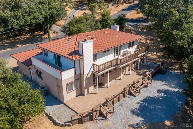 an aerial view of residential houses with outdoor space
