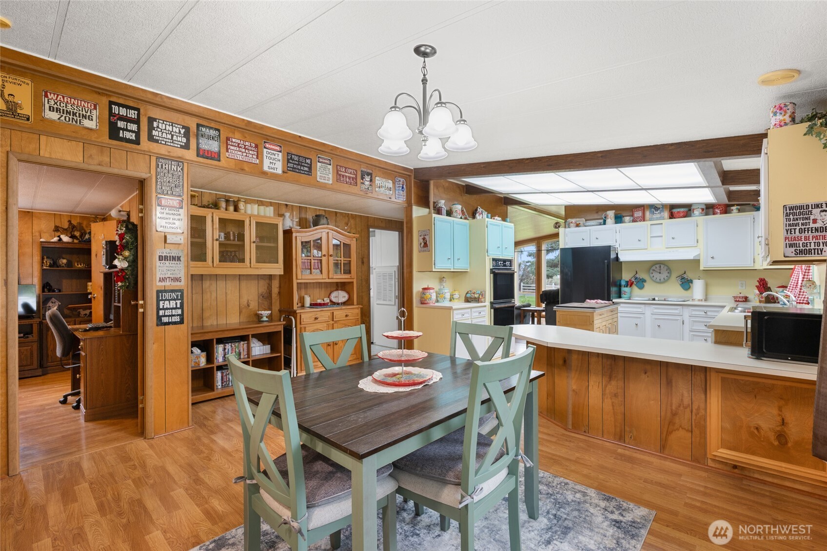 7472 Rd F Southeast, Unit 8 Othello, WA 99344 - Photo 15 of 40 a large kitchen with a table and chairs in it