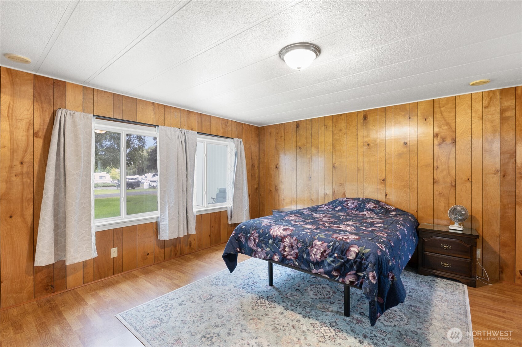 7472 Rd F Southeast, Unit 8 Othello, WA 99344 - Photo 16 of 40 a bedroom with a bed and large window