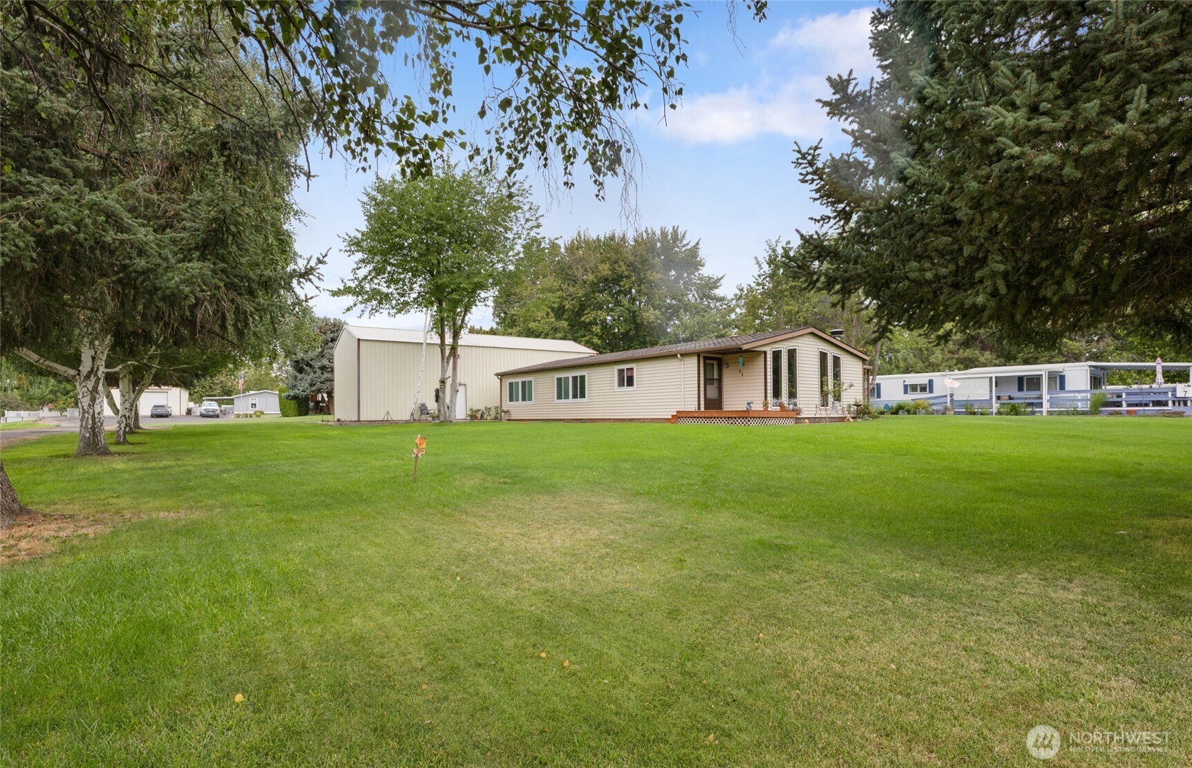 7472 Rd F Southeast, Unit 8 Othello, WA 99344 - Photo 27 of 40 a front view of house with yard and green space