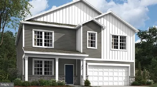 a front view of a house with a yard and balcony
