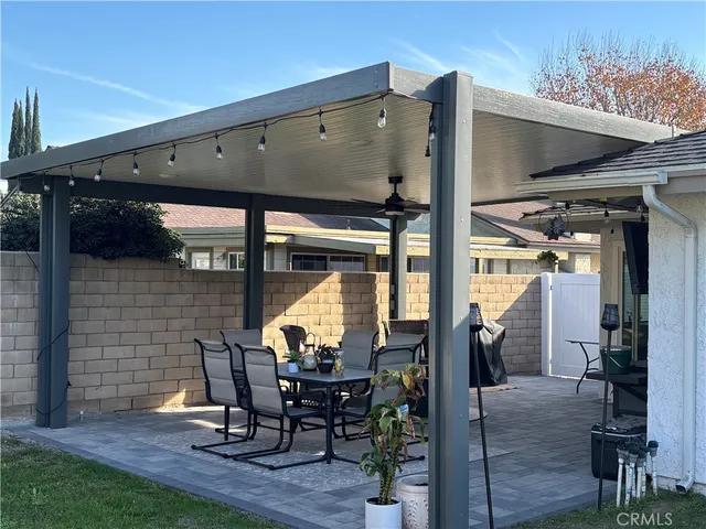 a view of living room with a table and chairs