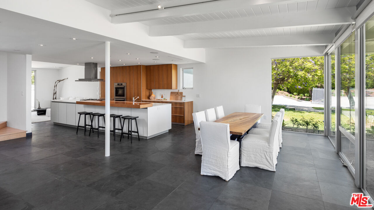 3431 Coast View Drive Malibu, CA 90265 - Photo 14 of 49 a living room with furniture a wooden floor and a large window
