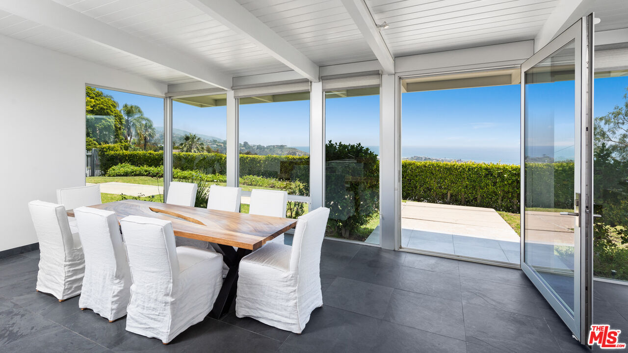 3431 Coast View Drive Malibu, CA 90265 - Photo 15 of 49 a dining room with furniture and window