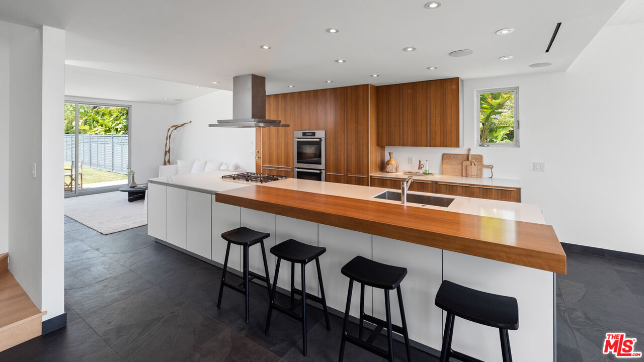3431 Coast View Drive Malibu, CA 90265 - Photo 17 of 49 a kitchen with a sink cabinets and window