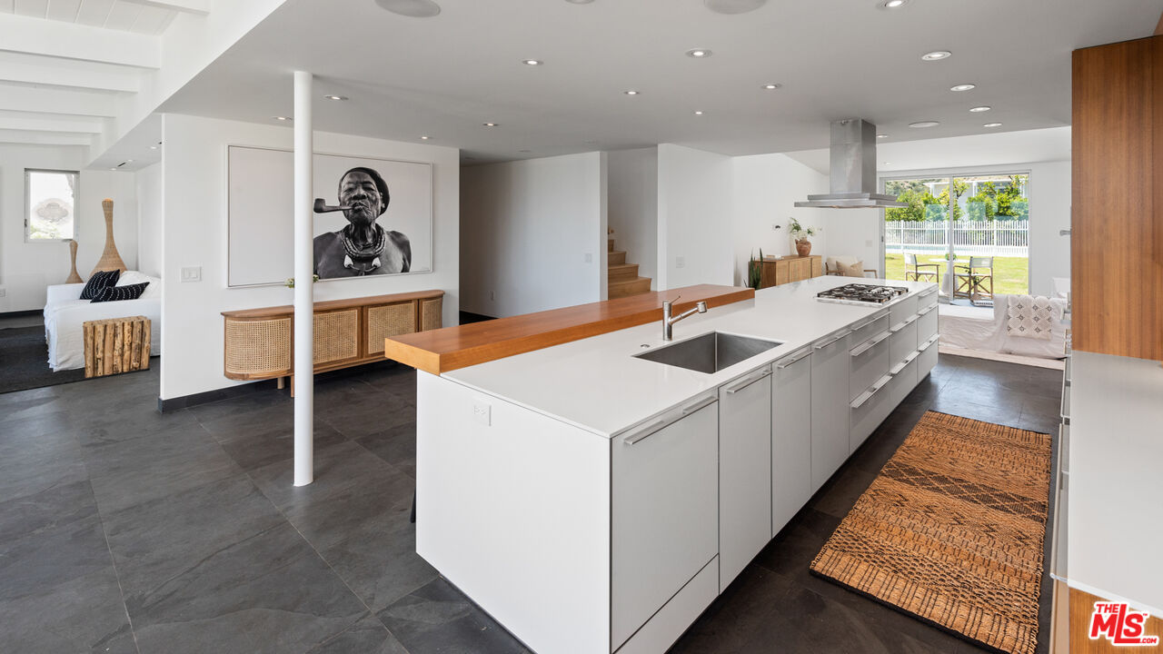 3431 Coast View Drive Malibu, CA 90265 - Photo 20 of 49 a kitchen that has a sink and a stove in it