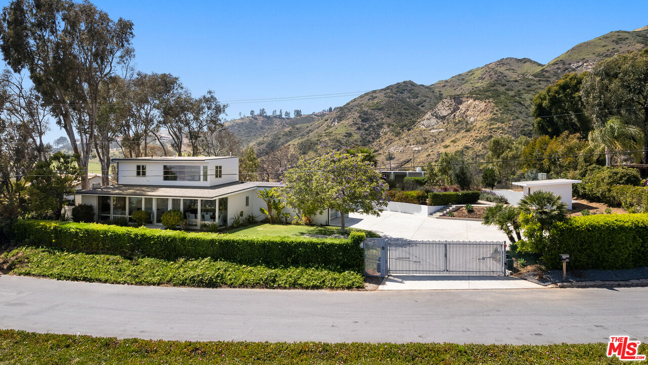 3431 Coast View Drive Malibu, CA 90265 - Photo 2 of 49 a view of houses with a street