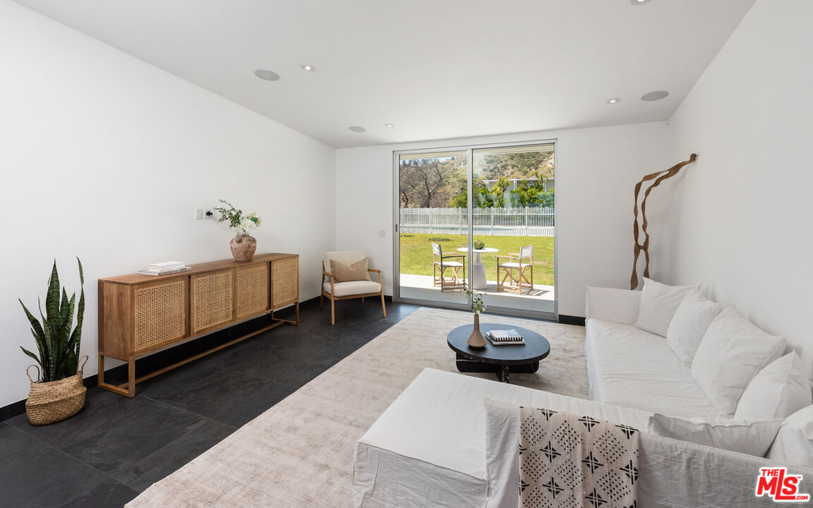 3431 Coast View Drive Malibu, CA 90265 - Photo 21 of 49 a living room with furniture and a large window