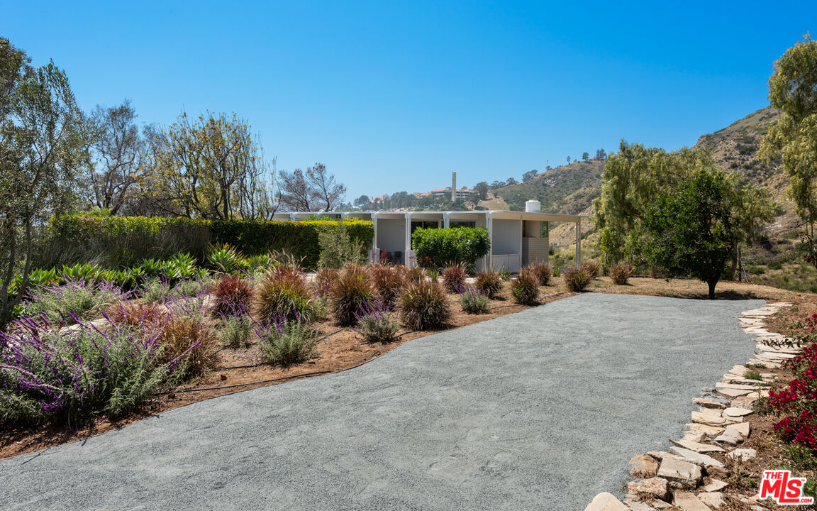 3431 Coast View Drive Malibu, CA 90265 - Photo 36 of 49 a view of a lake with a building in the background