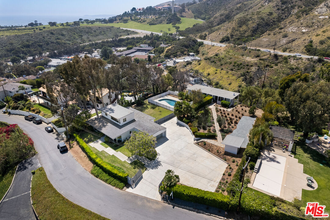 3431 Coast View Drive Malibu, CA 90265 - Photo 4 of 49 an aerial view of a house with a mountain