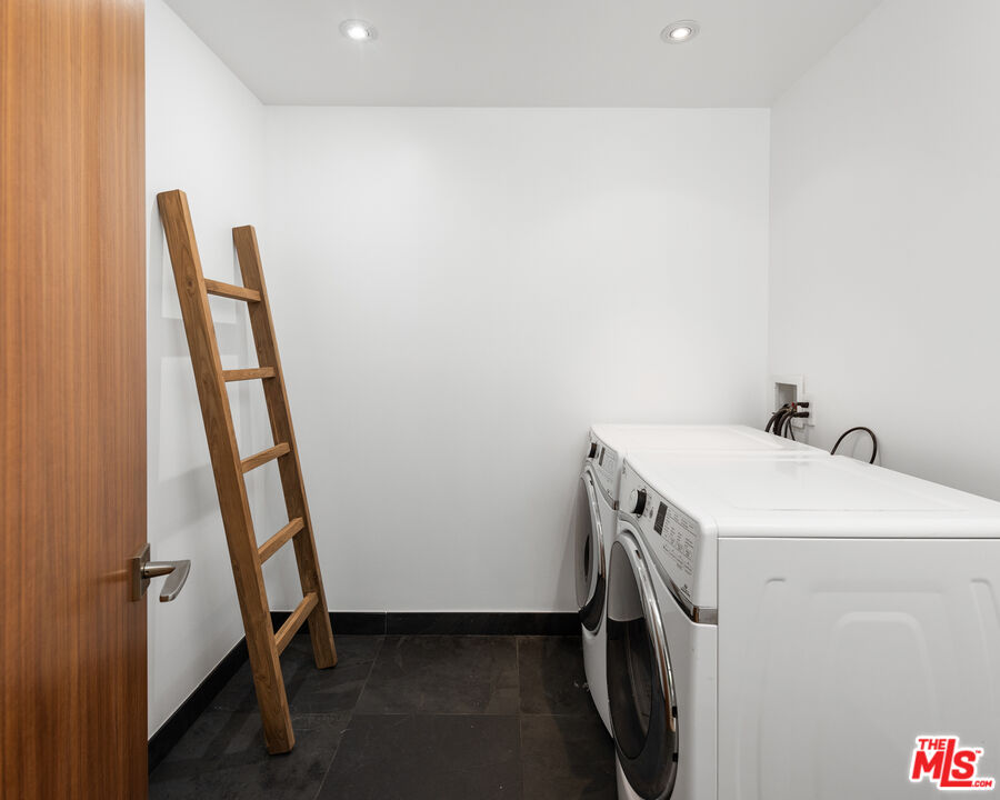 3431 Coast View Drive Malibu, CA 90265 - Photo 49 of 49 a utility room with dryer and washer