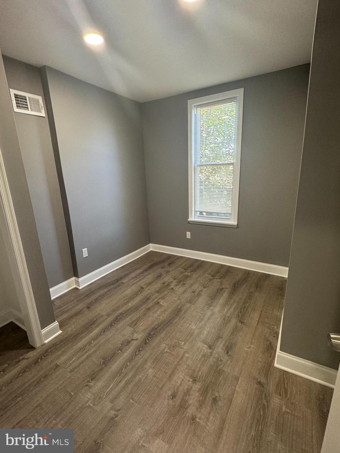 1722 South Taylor Street Philadelphia, PA 19145 - Photo 11 of 15 a view of an empty room with wooden floor and a window