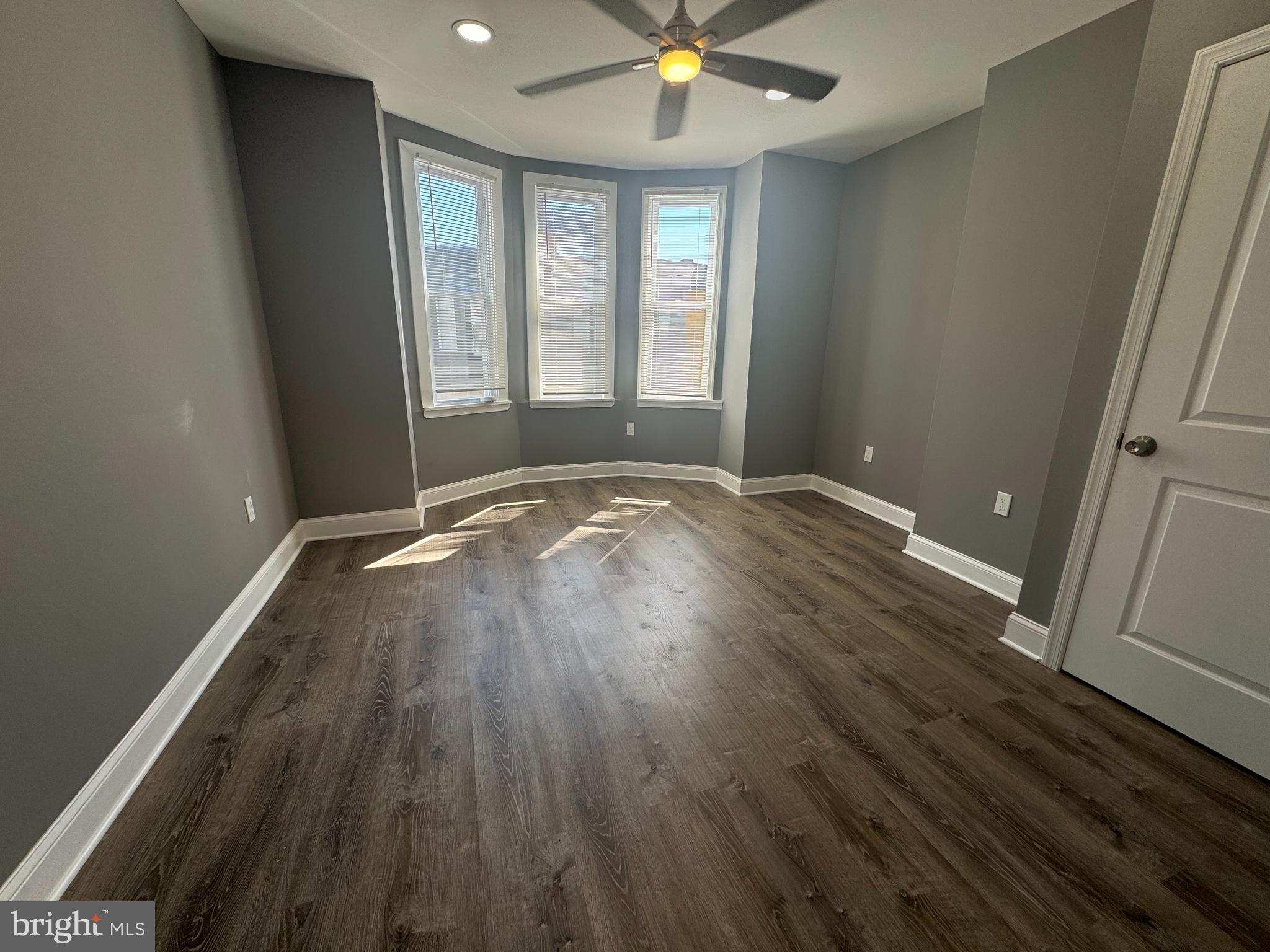 1722 South Taylor Street Philadelphia, PA 19145 - Photo 6 of 15 an empty room with wooden floor and windows