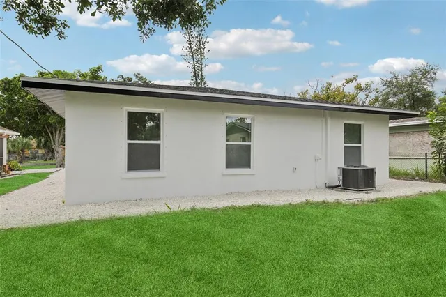 a backyard of a house with lots of green space
