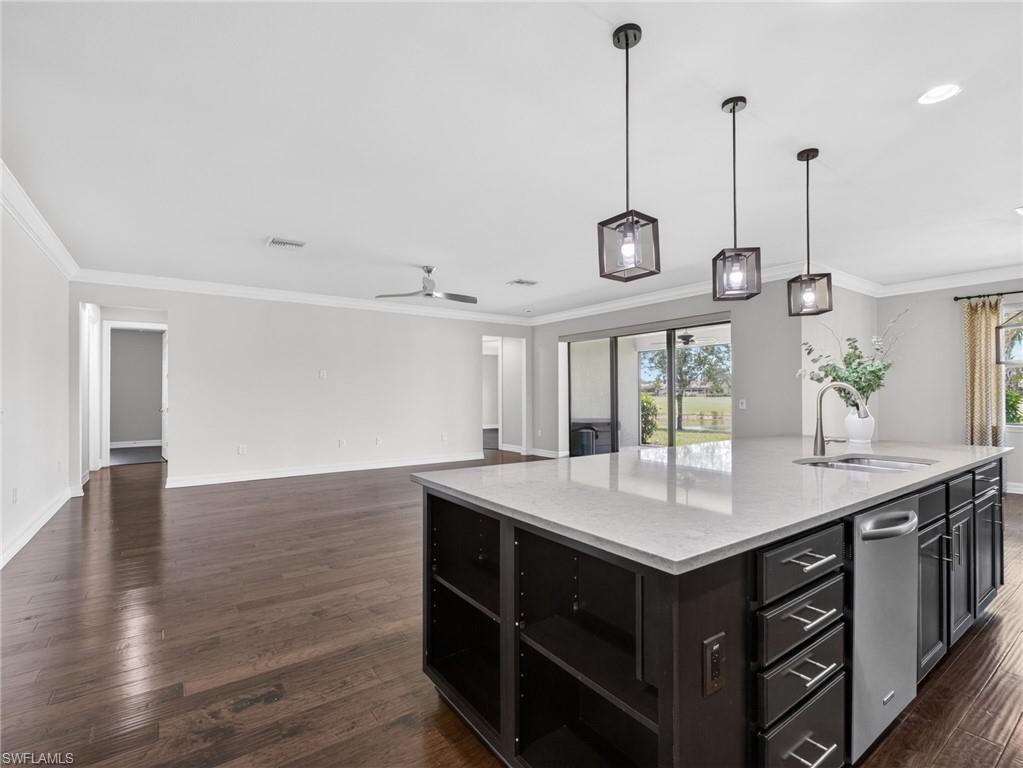 6124 Victory Drive Ave Maria, FL 34142 - Photo 15 of 50 a kitchen with a table and a large window