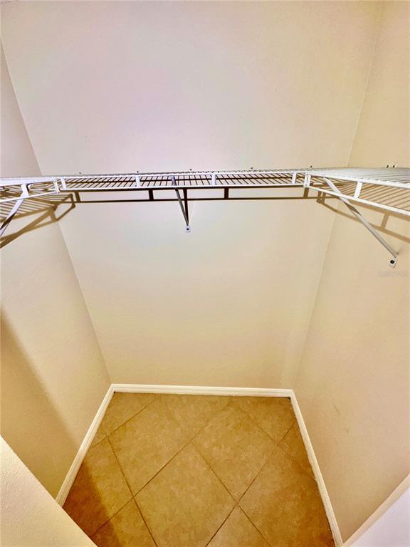 639 Cheshire Way Davenport, FL 33897 - Photo 11 of 15 a view of small space with racks on the wall