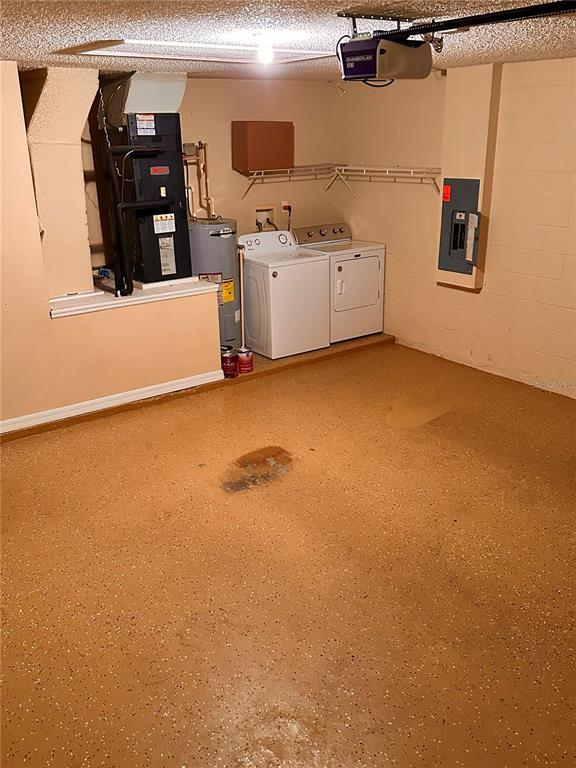 639 Cheshire Way Davenport, FL 33897 - Photo 14 of 15 a view of a storage and utility room with washer and dryer