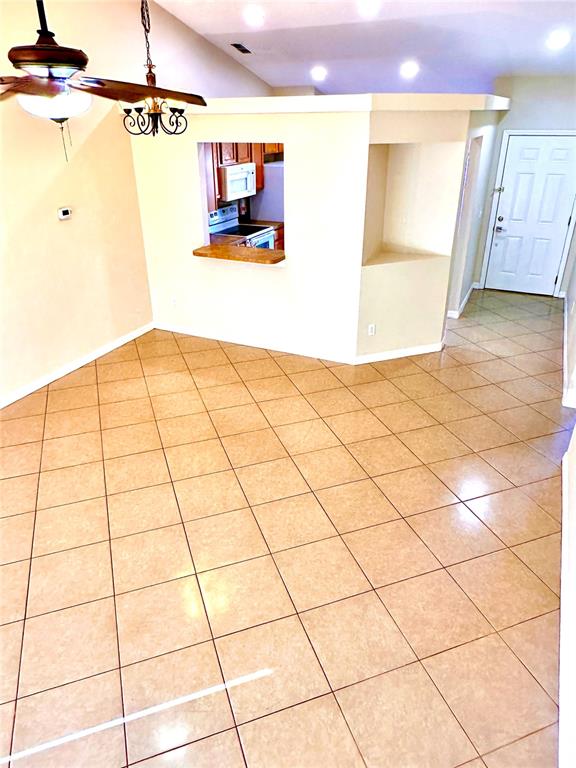 639 Cheshire Way Davenport, FL 33897 - Photo 5 of 15 a view of a refrigerator and window