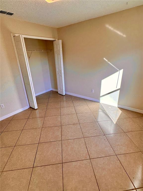 639 Cheshire Way Davenport, FL 33897 - Photo 7 of 15 a view of a livingroom with an empty space and a window
