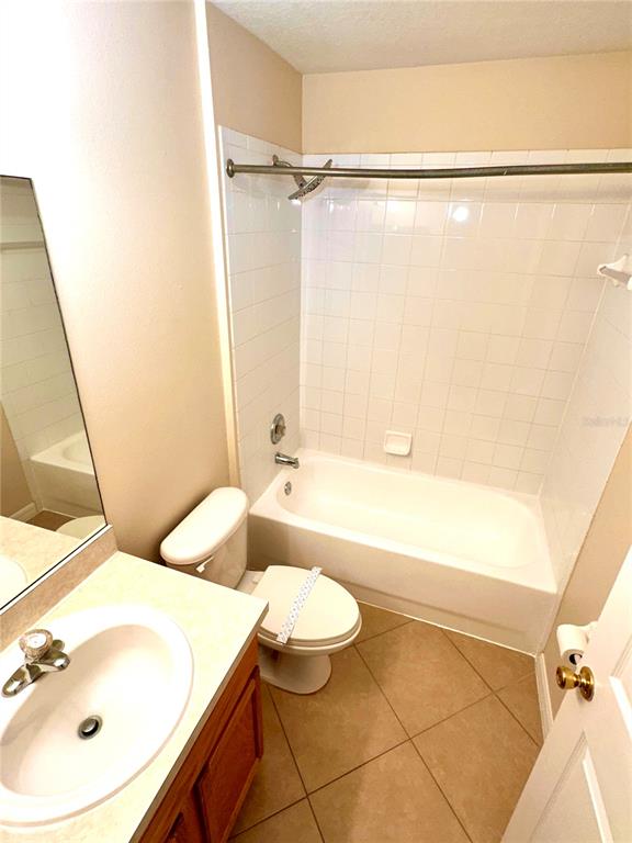 639 Cheshire Way Davenport, FL 33897 - Photo 8 of 15 a bathroom with a sink a toilet and shower