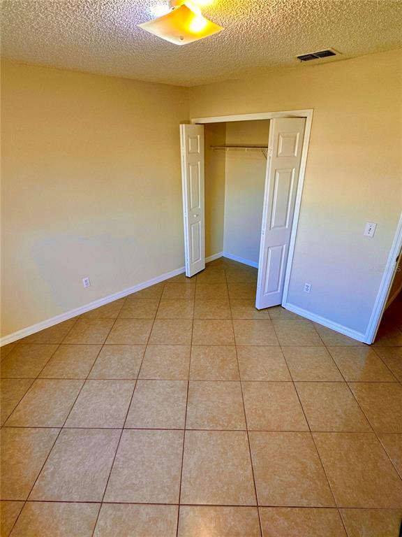 639 Cheshire Way Davenport, FL 33897 - Photo 9 of 15 a view of a livingroom with an empty space and a window
