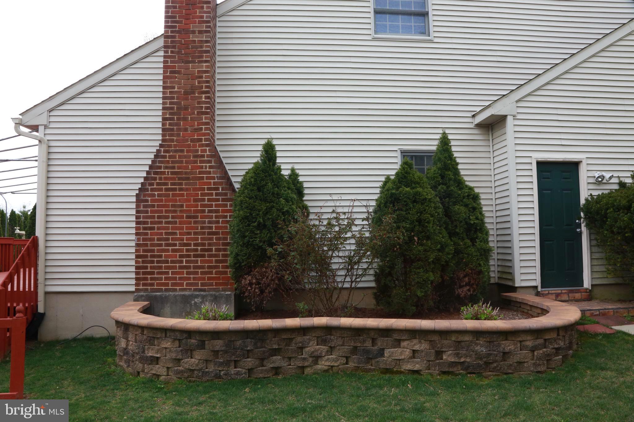 213 Ravenwood Road Exton, PA 19341 - Photo 7 of 56 Even the side of the home is landscaped