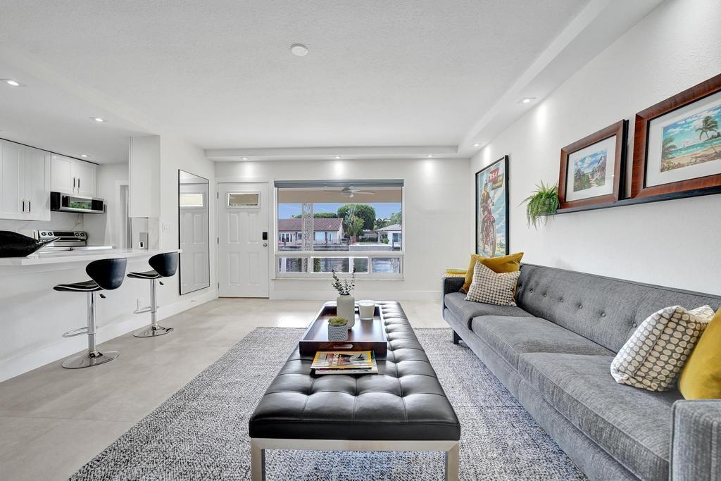 2866 Northeast 30th Street, Unit 9 Fort Lauderdale, FL 33306 - Photo 12 of 54 a living room with furniture and a potted plant