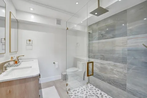 a bathroom with a sink a vanity and a mirror