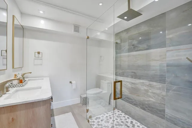 a bathroom with a sink a vanity and a mirror