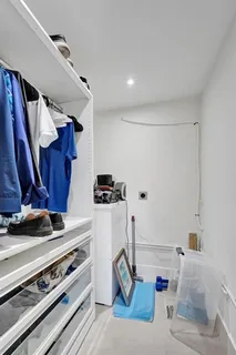 a bedroom with a large bed and a mirror