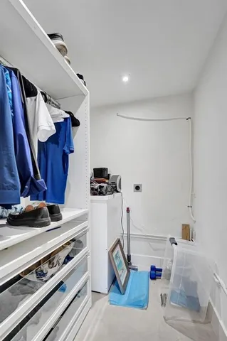 a bedroom with a large bed and a mirror