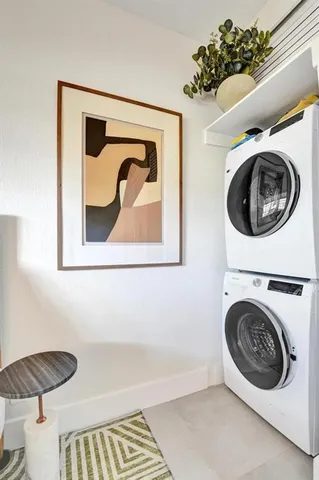 a spacious bathroom with a toilet sink double vanity and mirror