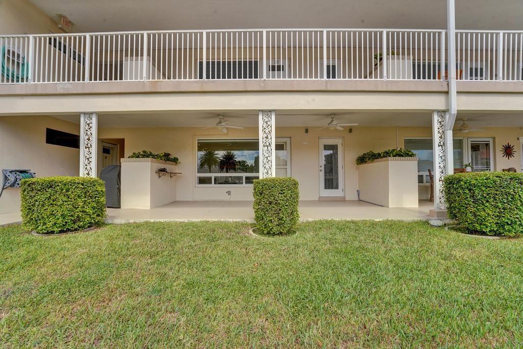 2866 Northeast 30th Street, Unit 9 Fort Lauderdale, FL 33306 - Photo 39 of 54 a view of a house with potted plants and a table