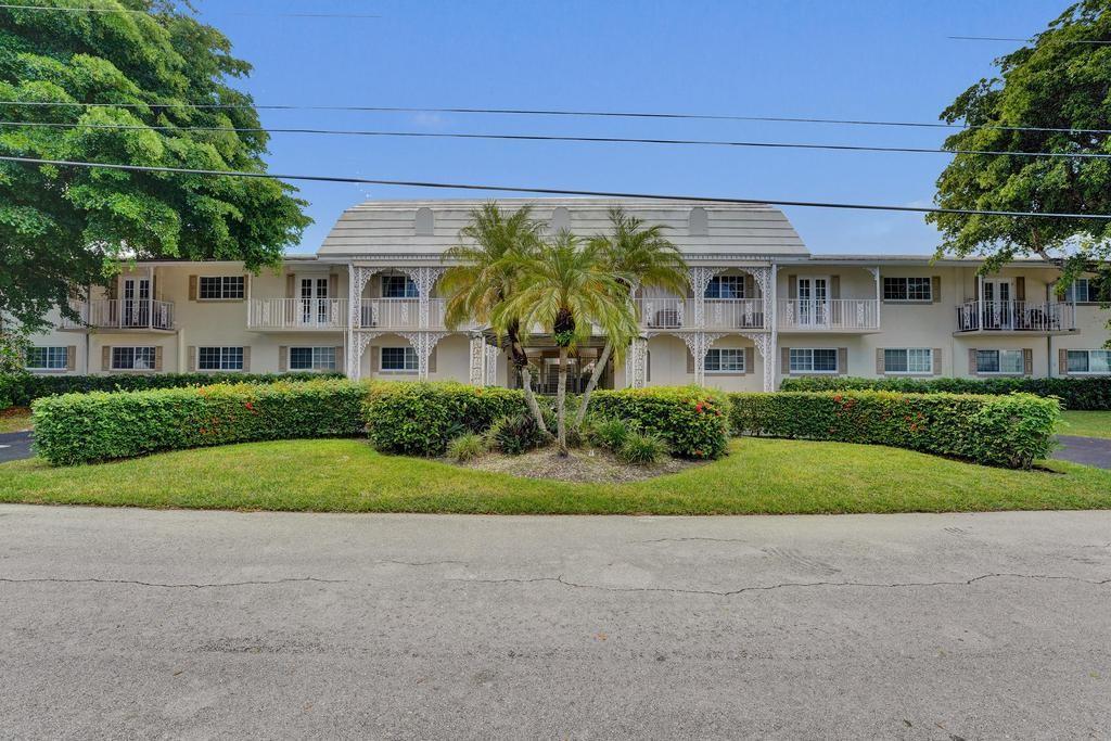 2866 Northeast 30th Street, Unit 9 Fort Lauderdale, FL 33306 - Photo 4 of 54 a view of a house with a yard