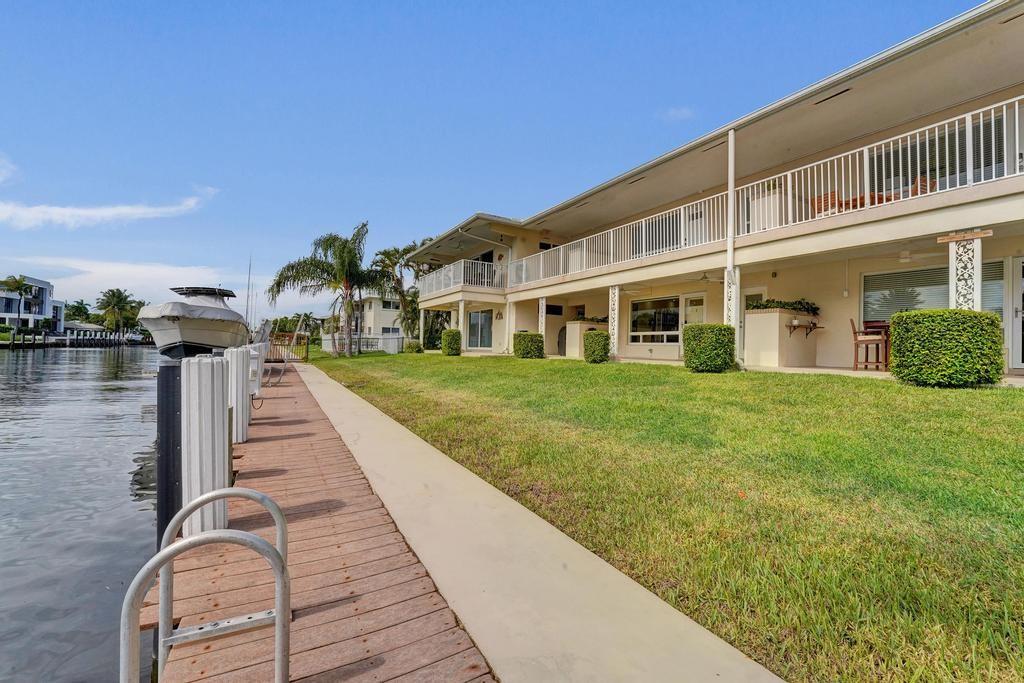 2866 Northeast 30th Street, Unit 9 Fort Lauderdale, FL 33306 - Photo 43 of 54 a house view with a garden space
