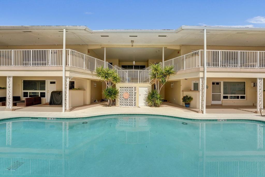 2866 Northeast 30th Street, Unit 9 Fort Lauderdale, FL 33306 - Photo 49 of 54 a view of a building with a yard