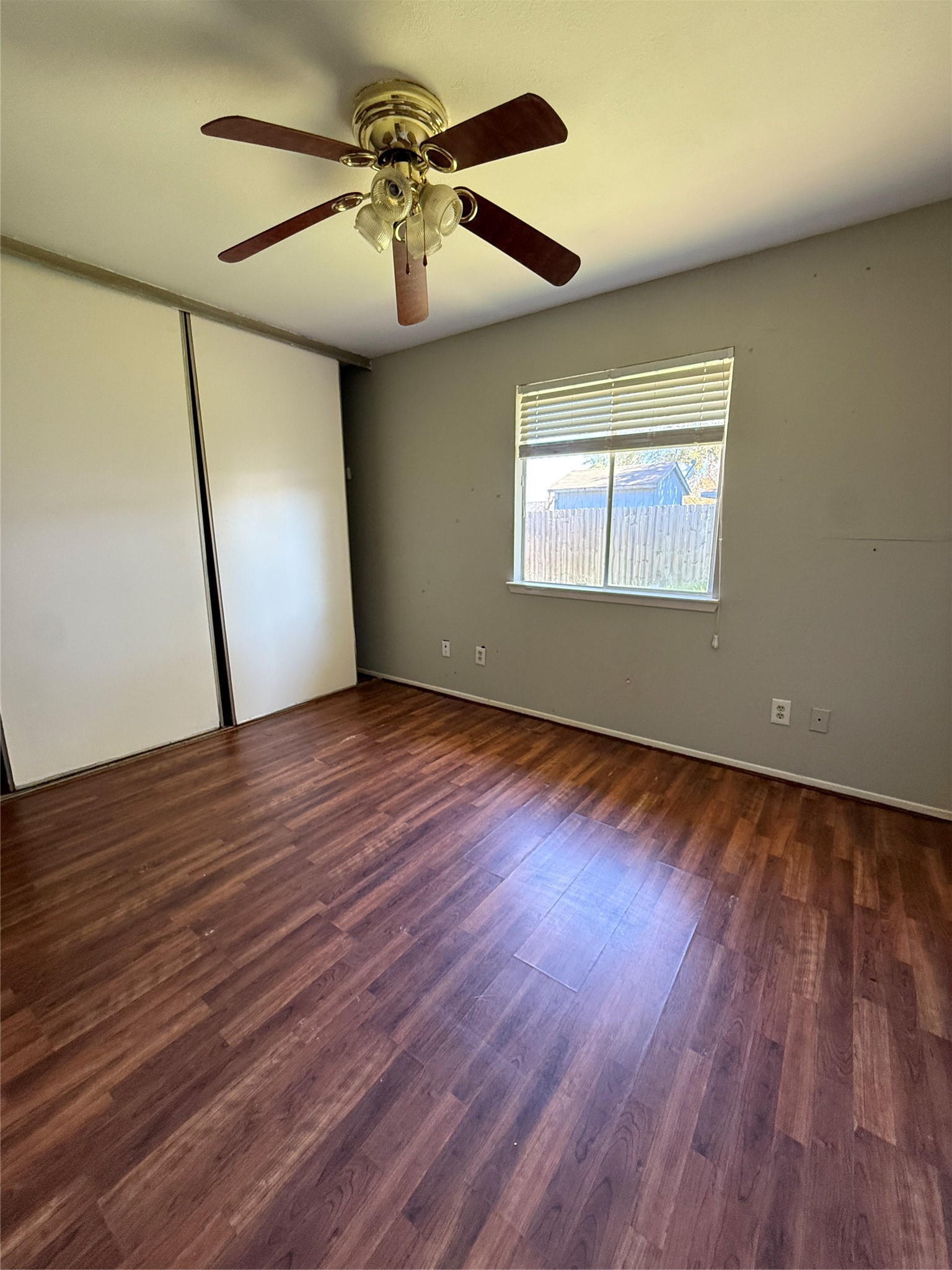 23346 Prairie Bird Drive Spring, TX 77373 - Photo 11 of 16 a view of an empty room with wooden floor and a window