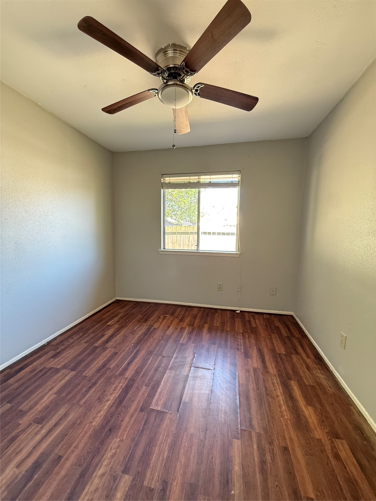 23346 Prairie Bird Drive Spring, TX 77373 - Photo 12 of 16 wooden floor in an empty room with a window