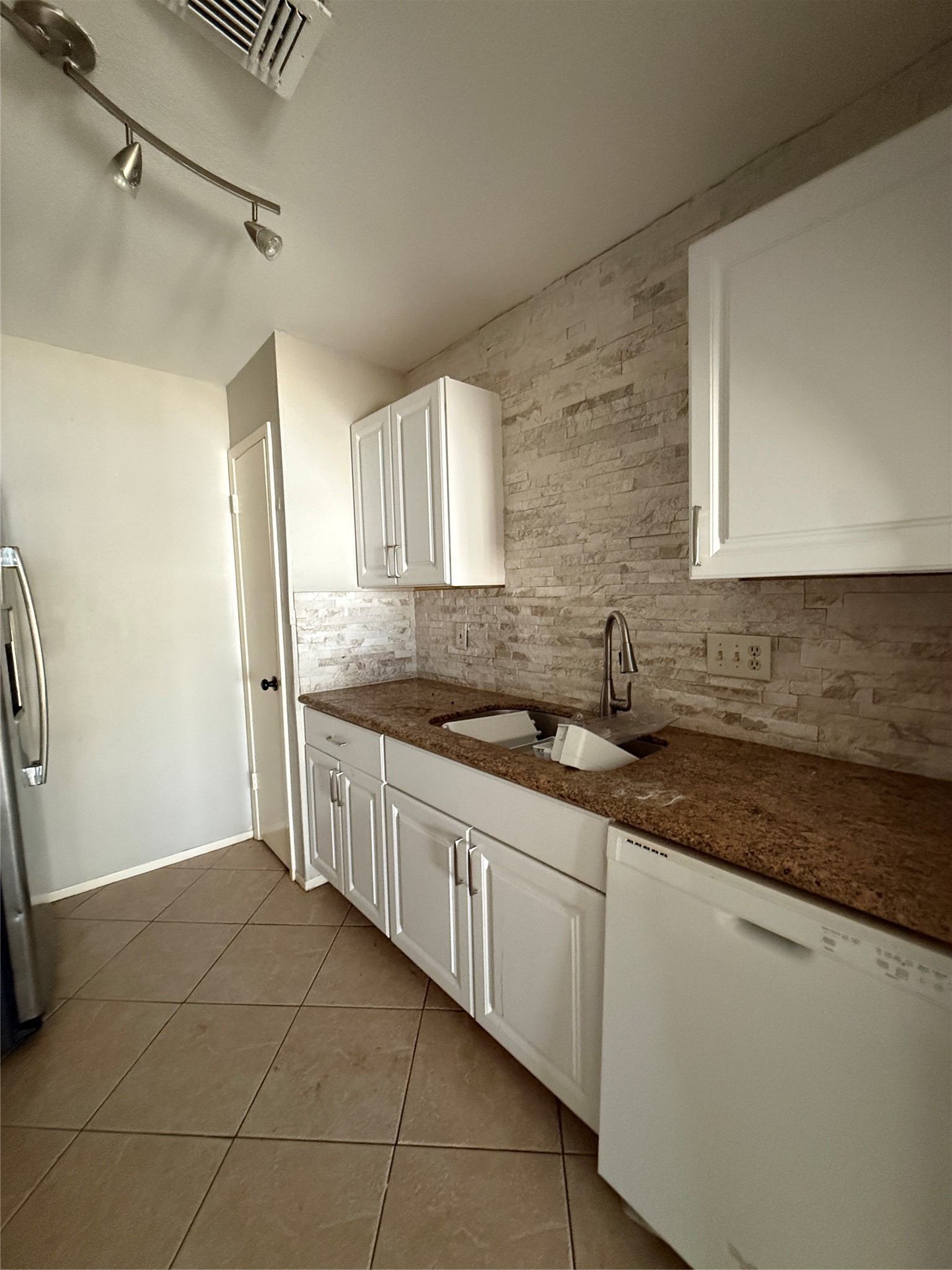 23346 Prairie Bird Drive Spring, TX 77373 - Photo 7 of 16 a kitchen with stainless steel appliances granite countertop a sink and a stove