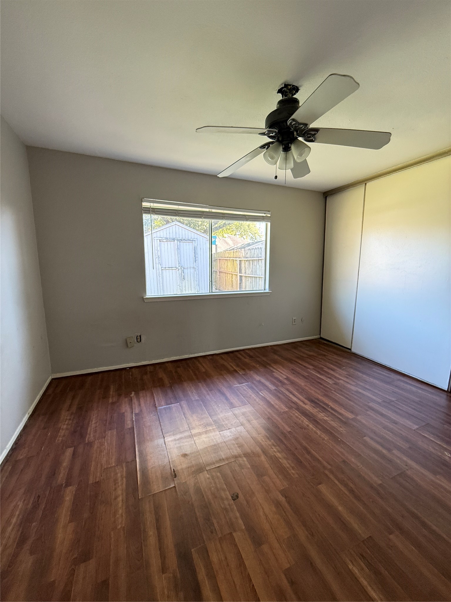 23346 Prairie Bird Drive Spring, TX 77373 - Photo 10 of 16 an empty room with wooden floor fan and windows